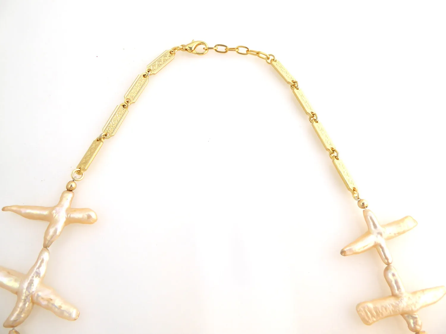 Pale peach pearl cross necklace