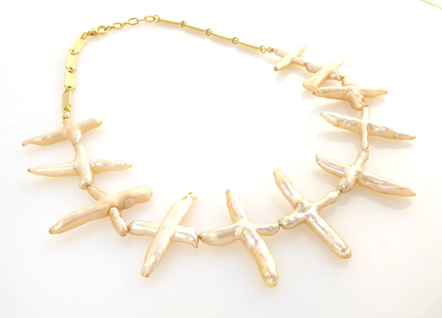 Pale peach pearl cross necklace